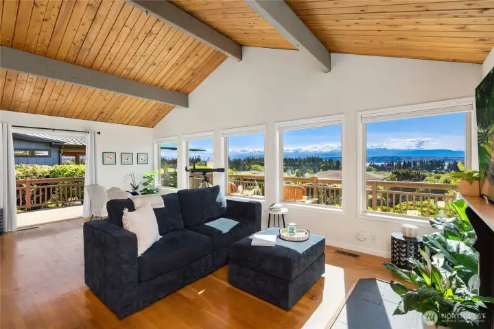 The great room features vaulted ceilings and warm hardwood floors with an inviting open layout deisgned for comfortable everyday living. The great room features vaulted ceilings and warm hardwood floors with an inviting open layout deisgned for comfortable everyday living.