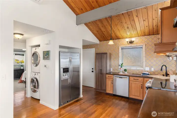 The kitchen features stainless steel appliances, warm hardwood floors, and an inviting layout designed for both everyday living and entertaining. The kitchen features stainless steel appliances, warm hardwood floors, and an inviting layout designed for both everyday living and entertaining.
