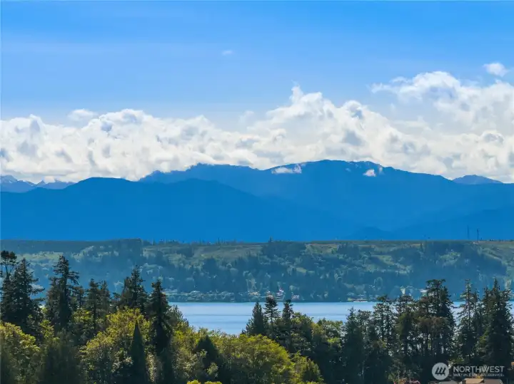 The ever-changing Olympic Mountain views create a breathtaking Pacific Northwest backdrop, with layered peaks, drifting clouds, and the sparkling Hood Canal stretching below. The ever-changing Olympic Mountain views create a breathtaking Pacific Northwest backdrop, with layered peaks, drifting clouds, and the sparkling Hood Canal stretching below.