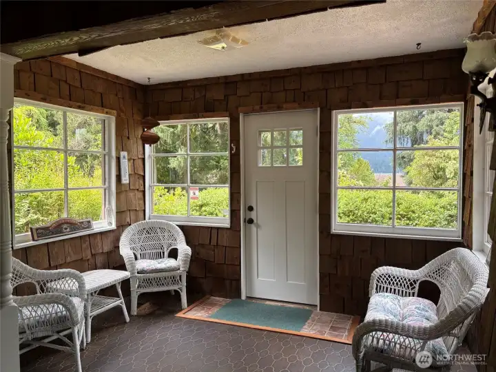Enclosed sun room entry to cabin.