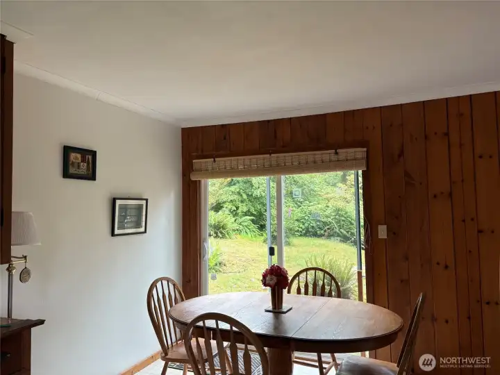 Dining area with slider to back yard.
