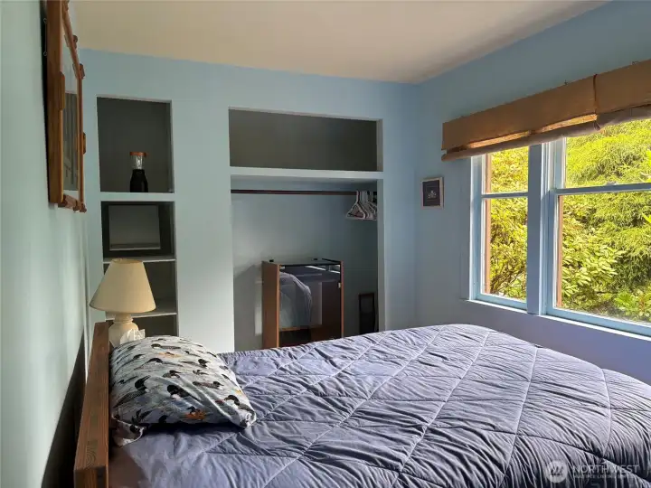 Bedroom with closet and shelving space.