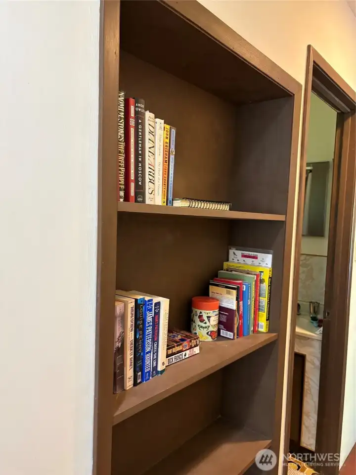 Built-in shelving unit in hallway.