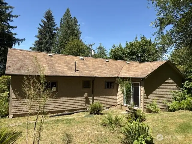 Slider off kitchen to back of lot. Terraced with septic tank and drainfield.