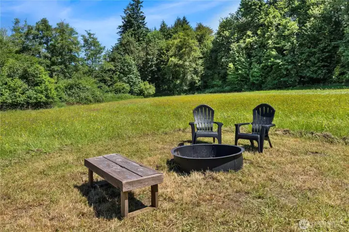 Sitting area in large field next to the creek!