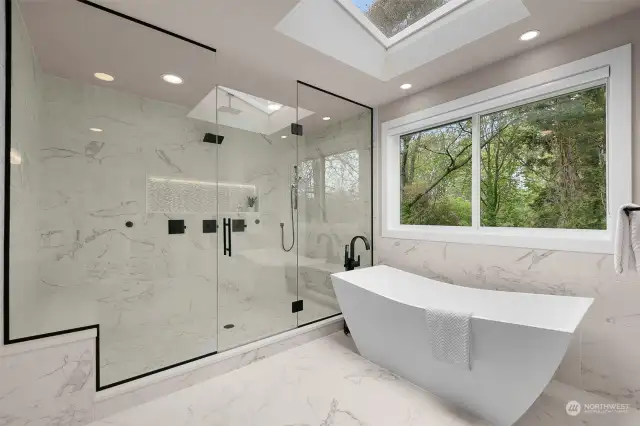 Huge step in shower with built in lighted benches, niche and rain shower!  Freestanding tub for relaxing soaks.