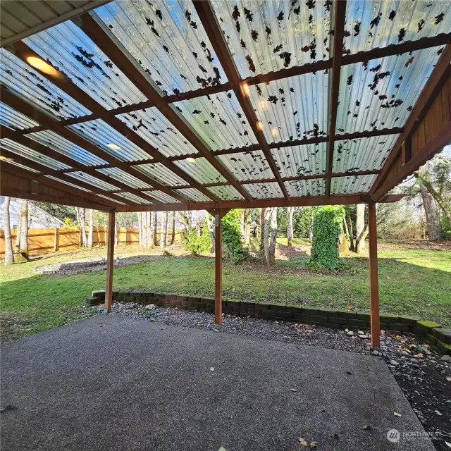 Covered patio off of kitchen and family room  Year round enjoyment!