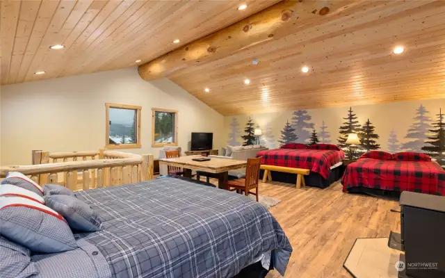 Vaulted ceilings with pine T&G contributes to the cozy cabin feel.