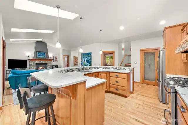 Gourmet kitchen is center stage to all the main floor activities