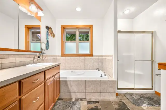 Double vanity, tub, shower and walk-in closet