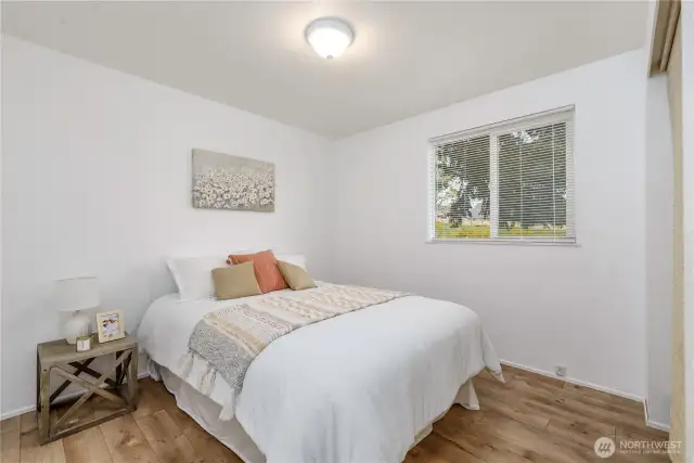 Second bedroom across from the primary and separated by the main bath.