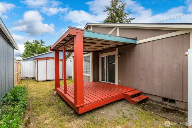 Storage shed in the background and another view of your fenced in yard.
