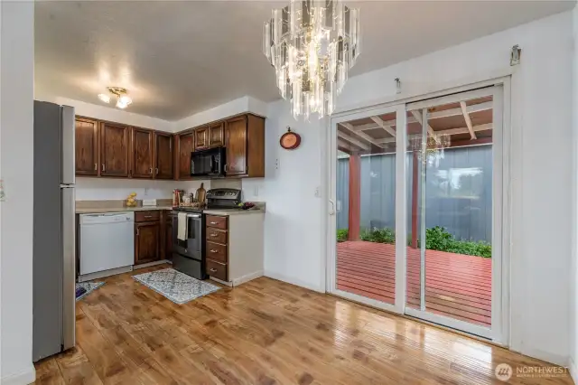 Efficient kitchen with room for a small table and access to the back covered deck.