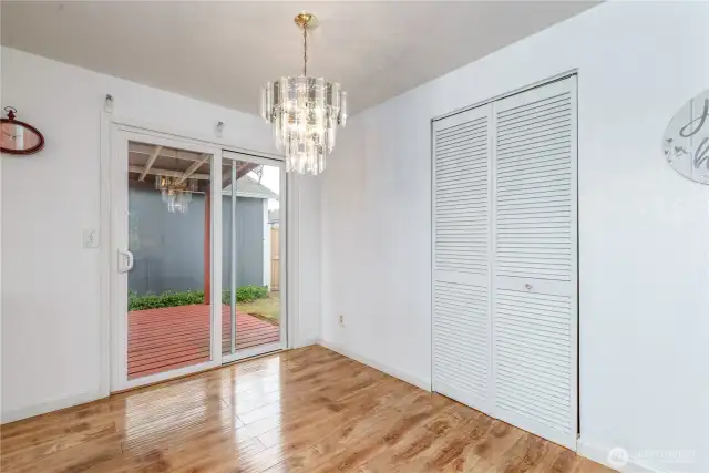Dining space off the kitchen with storage behind those louvered doors.