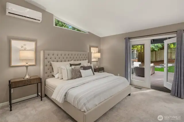 Primary bedroom - French doors lead to large Trex deck