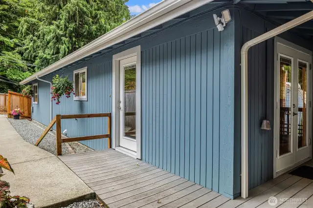 Deck to back length of home leading out to side garden