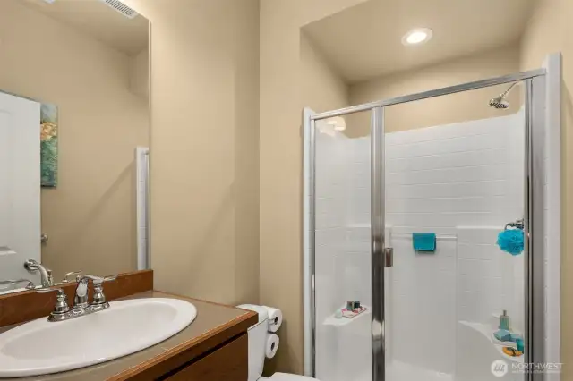 This lovely 3/4 bath is located on the main floor- Offering flexibility for guests.
