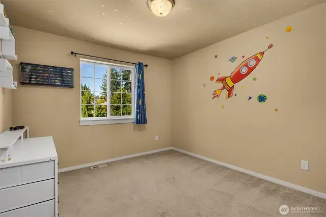 Upper bedroom with custom closet organizer.