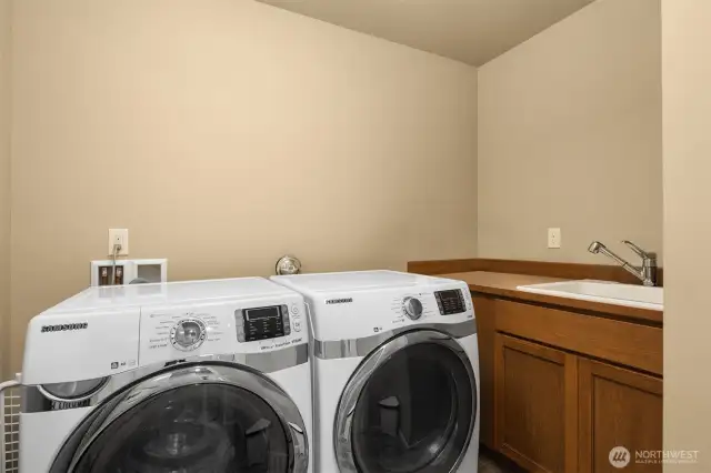 Upper utility room with handy utility sink.