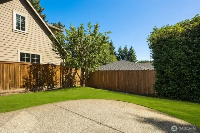 Lovely patio with garden space just beyond.
