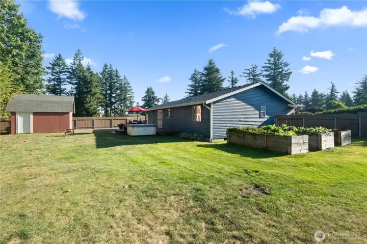 Huge backyard with raised garden beds