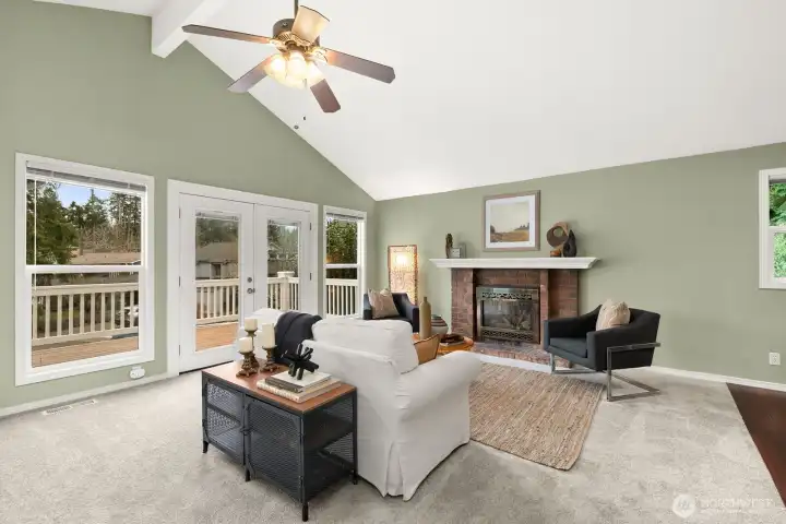 Perfect space to gather with fireplace and french doors out to great front deck.