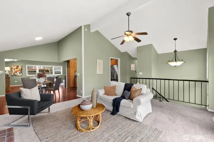 View looking back to dining area, kitchen & hall to bedrooms.