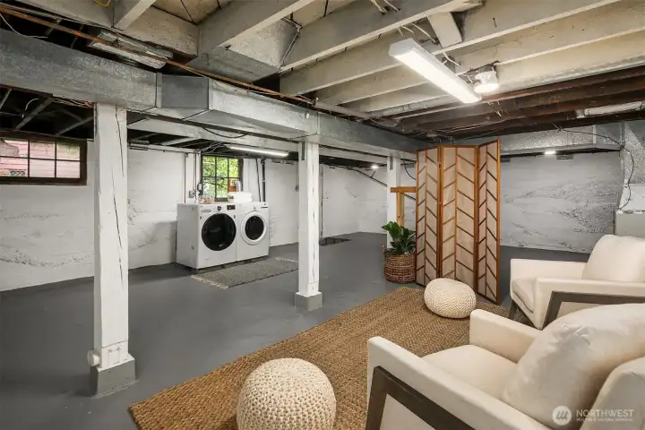 Lower level unfinished basement is great open space and laundry. Has an additional side door to it as well.