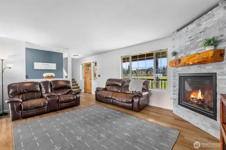 Another view of this gorgeous fireplace. Imagine how cozy this room is on a cold winter day. On the warmer days this home has AC.