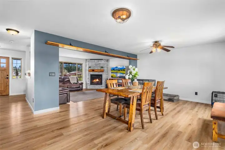 Another view of dining area. The wood above the dining room entrance is a shelf for pictures, objects, or memorabilia.