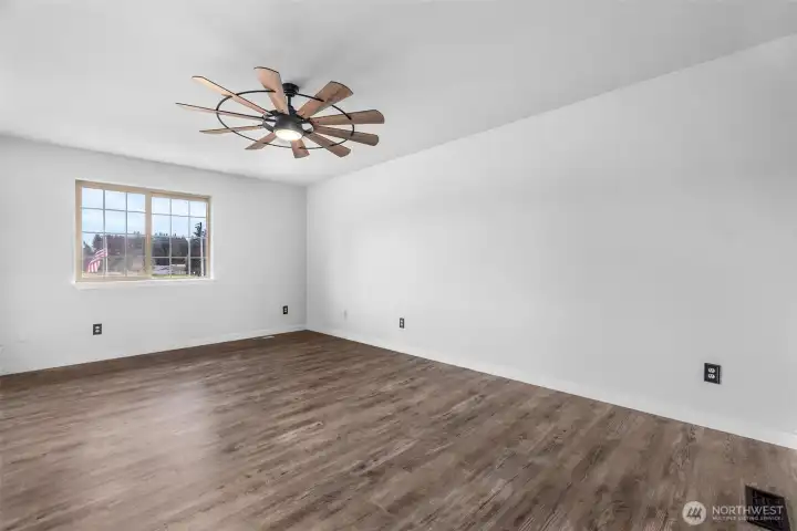 Large primary bedroom upstairs. This window faces front yard. New trim and doors upstairs rooms. Ceiling fans great for efficiency.