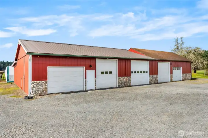 The shop- 200 amp main service. One 100 amp sub panel. Two 50 amp sub panels. Six 30 amp 220 plugs.12 foot eaves. Six inch concrete. Anchor points in slab. Six roll up doors. Four man doors. Ben pak 10,000 pound car/truck hoist.4 ton HVAC unit with spiral ductwork.Bathroom.Utility sink. Hot water.Small refrigerator.Office area.Fiberhigh speed internet. 4 power cord reels. One airhose reel. RV power plug. 110 plugs everywhere. Large attic space with plywood floor and an alarm system!