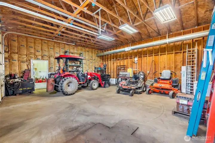 Please see the floorplan for the shop for better idea as to how each room flows.The shop- 200 amp main service. One 100 amp sub panel. Two 50 amp sub panels. Six 30 amp 220 plugs.12 foot eaves. Six inch concrete. Anchor points in slab. Six roll up doors. Four man doors. Ben pak 10,000 pound car/truck hoist.4 ton HVAC unit with spiral ductwork. Bathroom. Utility sink. Hot water. Small refrigerator. Office area. Fiber high speed internet. 4 power cord reels. One air hose reel. RV power plug. 110 plugs everywhere. Large attic space with plywood floor and an alarm system!