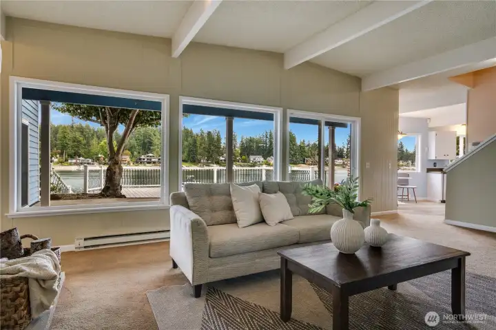 Living room framed by expansive windows with sweeping views of Horsehead Bay