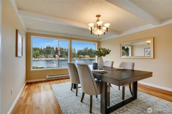 Formal dining room perfectly positioned to capture sweeping views of the bay