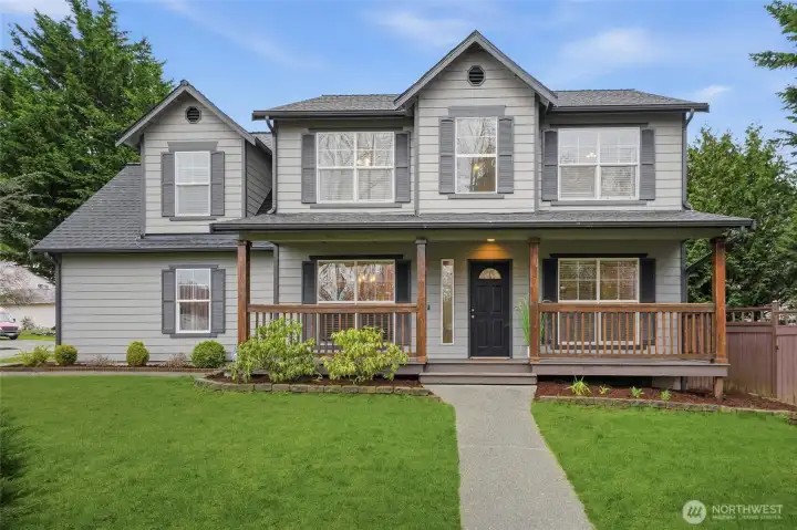 Welcoming entryway with charming curb appeal and fresh exterior paint.