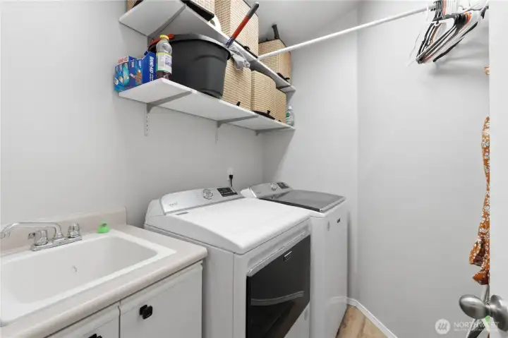 Laundry room with utility sink.