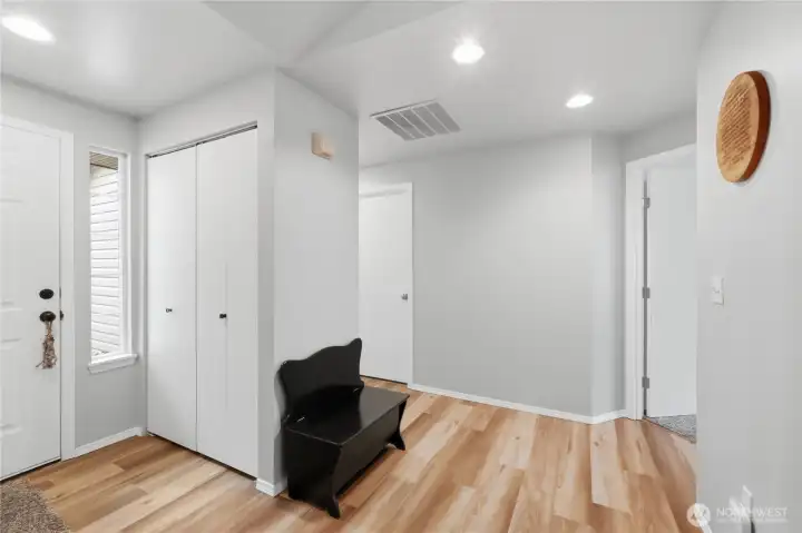 Spacious hallway leads to three bedrooms and two full baths.