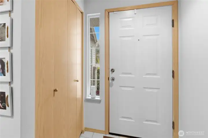 Tile flooring and spacious coat closet at entry.  Side light for the northern exposure and soft lighting throughout the day.
