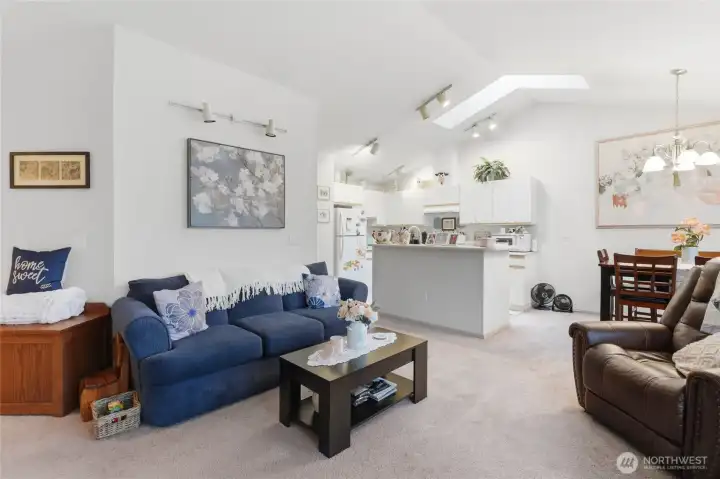 Carpet throughout the living and dining area.  The skylight is also a feature at the other unit.