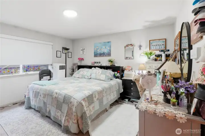 Primary bedroom has wall-to-wall carpet.