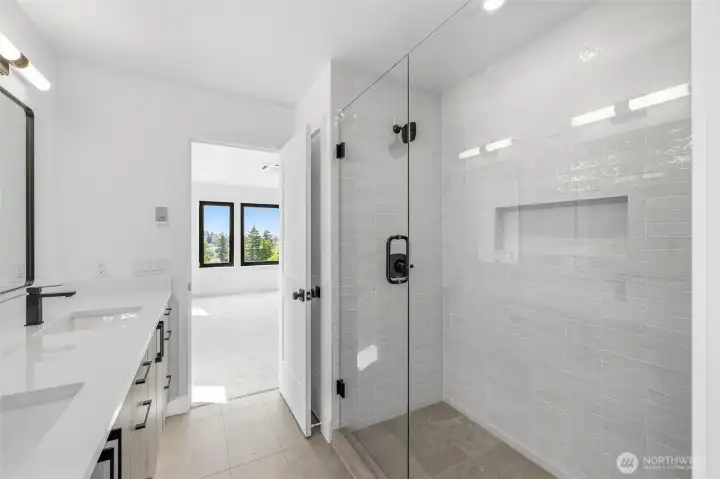 Beautiful tile work in the primary suite 3/4 bath.