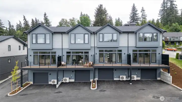 A view of the back of the townhome building with 1105 Divine at the far right end.