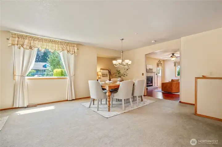 View from office showing the formal dining area with an alcove, kitchen in the background with stairwell to far right View from office showing the formal dining area with an alcove, kitchen in the background with stairwell to far right