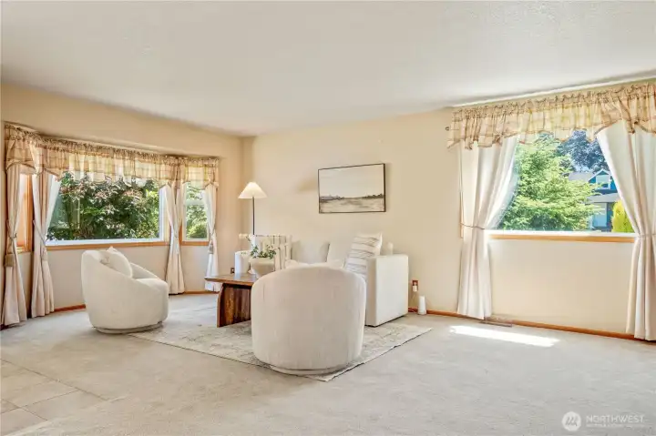 Spacious living room with the home providing natural lighting thruout. The openess of the area provides flexability Spacious living room with the home providing natural lighting thruout. The openess of the area provides flexability