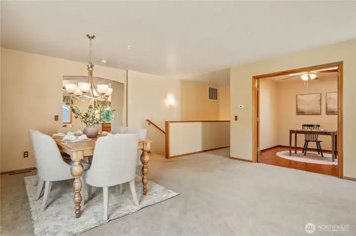 Formal dining area with kitchen in the background Formal dining area with kitchen in the background