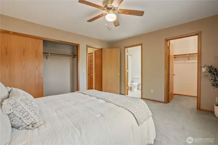 View in the suite showing walk-in closet and bathroom with door to hallway. View in the suite showing walk-in closet and bathroom with door to hallway.