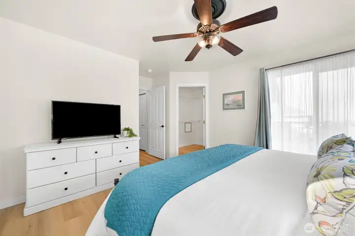 Primary bedroom has a large walk-in closet and sliding door to deck Primary bedroom has a large walk-in closet and sliding door to deck
