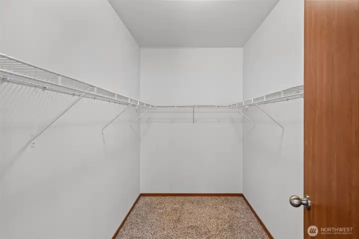 Primary walk-in closet Primary walk-in closet