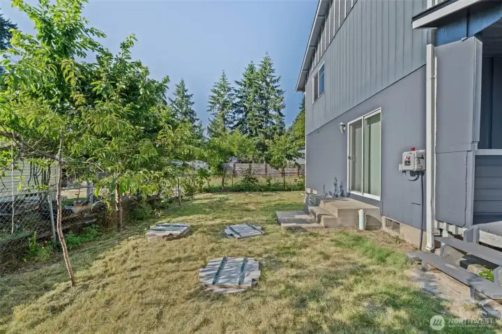 Side and back yard~those are septic lids Side and back yard~those are septic lids
